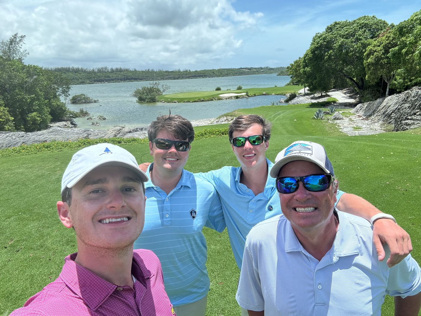 Golfers at a scenic oceanside golf course in the Bahamas